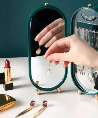 Foldable dustproof jewelry organizer with mirror, earring slots and necklace hanging holder for travel and home use