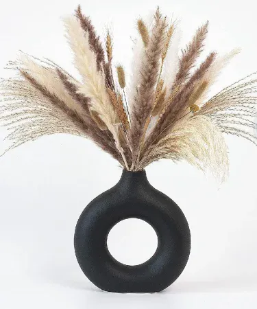 Handmade doughnut shaped flower vase 8x8 inches, modern home décor piece displayed with artificial flowers, high‑quality painted finish, suitable for table and shelf decoration,