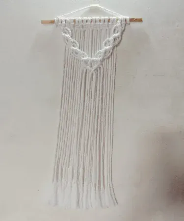 Handmade cotton macrame wall hanging in off‑white boho style for home décor
