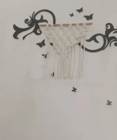 small handcrafted macrame wall hanging design for home décor , imagecaption=Elegant small macrame wall hanging – perfect for any wall ,