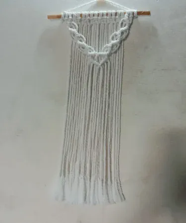 Handmade cotton macrame wall hanging in off‑white boho style for home décor