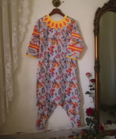 Autumn Style Applic Neck Lawn 2‑Piece soft grey suit with orange, red and yellow floral prints, knee‑length, long sleeves, modern neckline and bold sleeve stripes