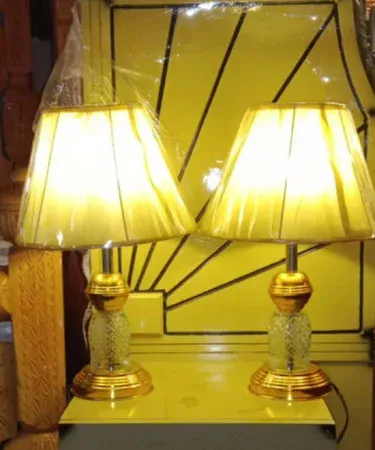 Golden modern 2‑piece metal and glass table lamp set with clear shade, 18 inch height, perfect for bedside and living‑room décor, imagecaption=Elegant golden metal‑glass table lamp set – ideal for adding a stylish lighting touch to any room.