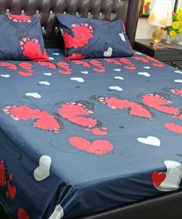 King size double bedsheet set with two plush pillows on a neatly made bed, showcasing luxurious cotton blend fabric and elegant design.