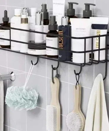 Wall mounted black‑coated metal storage rack – multi‑purpose iron shelf for kitchen, bathroom & home décor, imagecaption=Stylish wall‑mounted metal rack perfect for organizing spices, bottles, and décor items in any Pakistani home.