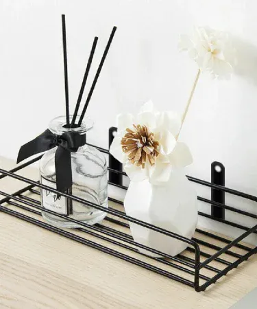 Wall mounted black‑coated metal storage rack – multi‑purpose iron shelf for kitchen, bathroom & home décor, imagecaption=Stylish wall‑mounted metal rack perfect for organizing spices, bottles, and décor items in any Pakistani home.