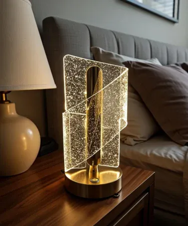 Elegant Touch Control 3D LED Table Lamp with warm yellow light and alloy base – modern decorative bedside lamp, imagecaption=Elegant Touch Control 3D LED Table Lamp showcased on a bedside table, adding warm ambient lighting.