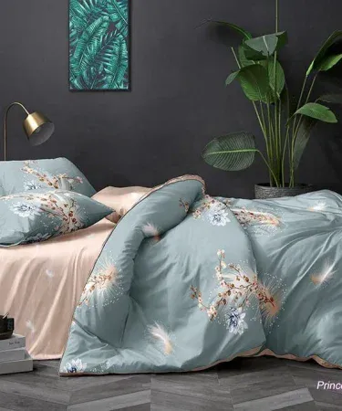 King size double bedsheet set with two plush pillows on a neatly made bed, showcasing luxurious soft fabric and elegant design.