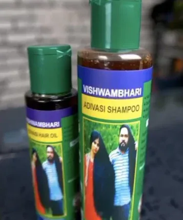 Adavasi herbal hair shampoo and oil bottle with natural ingredients background