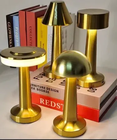 Golden Mushroom rechargeable LED table lamp with touch sensor and USB‑C charging, showing three light mode icons on a modern desk. , imagecaption=Golden Mushroom LED Table Lamp – perfect for study, work, and ambient lighting, available on Khareedo | Kharedo across Pakistan. ,