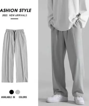 Grey wide‑leg jersey trousers with elastic waistband, soft jersey fabric and relaxed fit for casual wear