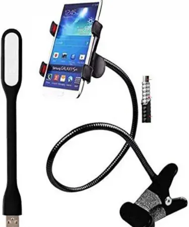 Black ABS plastic mobile phone holder on a desk, imagecaption=Khareedo | Kharedo mobile phone holder – sturdy ABS stand for smartphones.