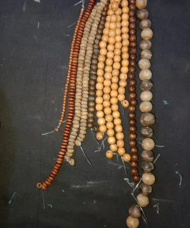 20 wooden beads in assorted natural colors for DIY bracelets and necklaces , imagecaption=Premium quality wooden beads (20 pcs) perfect for creating stylish bracelets and necklaces ,