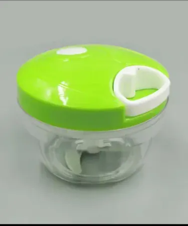 handheld 3‑blade spin cutter chopping vegetables on kitchen counter, imagecaption=Khareedo | Kharedo Spin Cutter – versatile 3‑blade handheld food chopper for effortless kitchen prep.