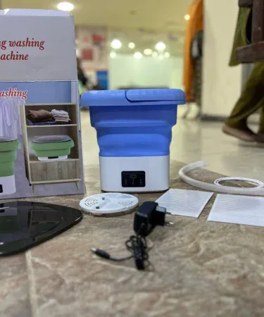 Abu Turab (أبو تراب) foldable portable washing machine compact design, imagecaption=Abu Turab (أبو تراب) Mini Foldable Washing Machine – perfect for small spaces.