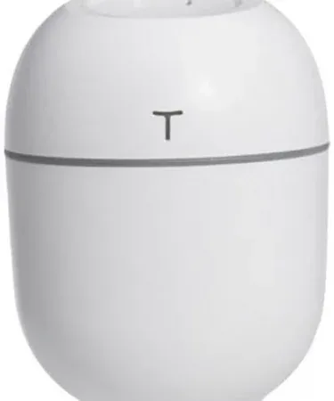 Abu Turab (أبو تراب) mini USB air humidifier and cool mist diffuser on a wooden desk with soft LED lighting, showing its compact design and portable size.