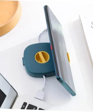 Abu Turab (أبو تراب) rotating cable organizer box with phone holder, portable wire storage for earphones and mouse cables, assorted colors, compact design for desk and travel