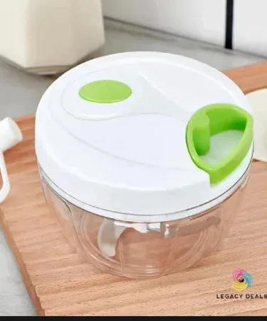 handheld 3‑blade spin cutter chopping vegetables on kitchen counter, imagecaption=Khareedo | Kharedo Spin Cutter – versatile 3‑blade handheld food chopper for effortless kitchen prep.
