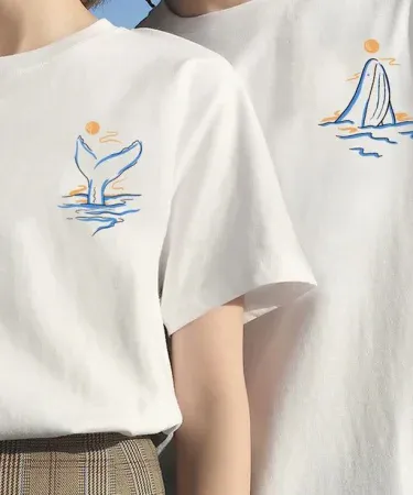 Whale Tale Couple Tees – matching whale‑themed couple t‑shirts – Sea & Me design, imagecaption=Couple wearing Whale Tale matching tees – perfect ocean‑lover apparel.