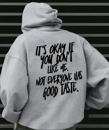 Grey hoodie for men with bold black text on the back, imagecaption=Grey hoodie featuring the statement “It’s okay if you don’t like me. Not everyone has good taste.”