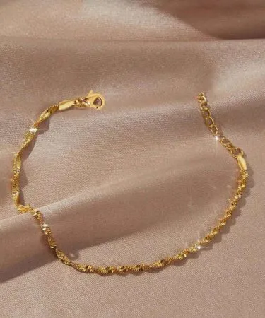 Aomogo 1pc 18K Gold Plated Stainless Steel Fine Chain Bracelet – elegant gold plated jewelry on a white background , imagecaption=Elegant Aomogo 18K gold plated stainless steel fine chain bracelet displayed on a sleek surface ,