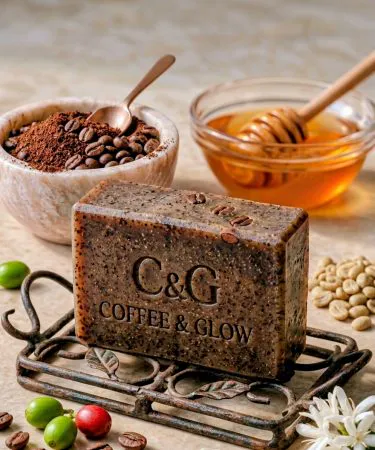 Handmade organic coffee soap bar with coffee grounds and natural ingredients, displayed on a wooden surface.