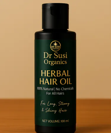 Dr Susi Organics Herbal Hair Oil bottle with natural herbal leaves and cold‑pressed oil droplets, imagecaption=Dr Susi Organics Herbal Hair Oil – 100% natural, herbal hair care solution for strong, shiny hair.