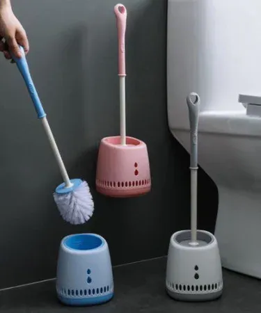 Toilet brush with quick‑dry holder set in vibrant multicolor, pure plastic and silicone bristles, displayed on a bathroom floor.