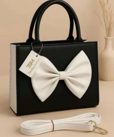 Bow style handbag with synthetic leather and adjustable belt, featuring a stylish bow detail – perfect for everyday use
