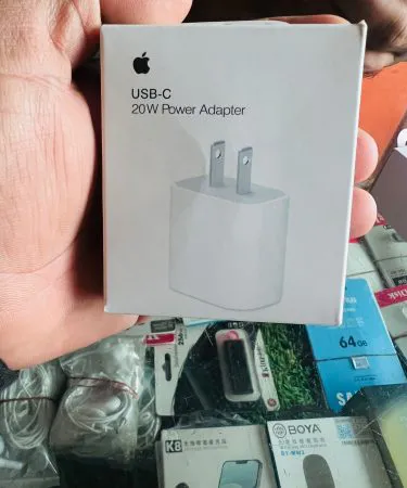 Apple USB‑C 20W Power Adapter white charger with USB‑C port, imagecaption=Apple USB‑C 20W Power Adapter – Fast charging for iPhone, iPad and other USB‑C devices.