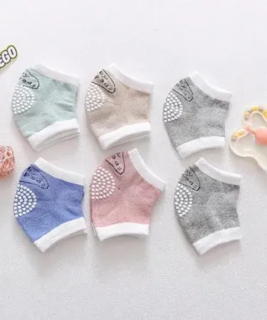 Baby wearing elastic anti‑slip knee pads for crawling safety