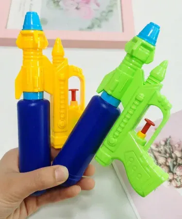 Kids water gun in bright colors, perfect for outdoor summer play, imagecaption=Vibrant multi‑color kids water gun – powerful spray for ages 5+ – available now on Khareedo | Kharedo,