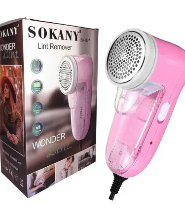 Portable electric lint remover with USB charging, 3‑blade stainless steel system and honeycomb net for safe fabric cleaning, imagecaption=Compact fabric defuzzer – perfect for clothes, furniture and travel.