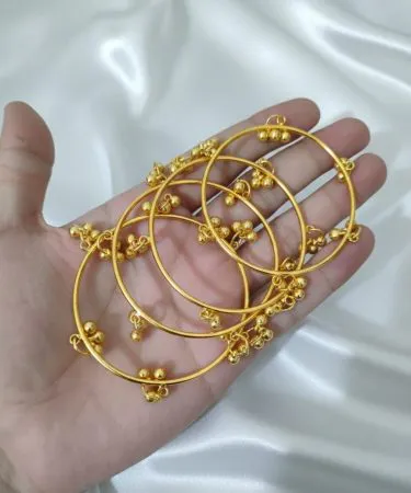 handcrafted silver Kashmiri bangles with intricate embroidery on a velvet background, imagecaption=Elegant handcrafted Kashmiri bangles available on Khareedo|Kharedo – shop now with COD.