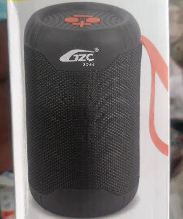 Mini Speaker -3066 portable Bluetooth speaker with sleek black finish, compact size, and built‑in microphone, displayed on a wooden table. , imagecaption=Mini Speaker -3066 – compact, high‑quality Bluetooth speaker perfect for home and travel. ,