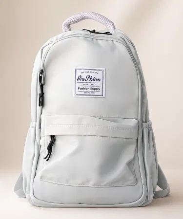 China Imported mint green college bag with multiple compartments and ergonomic shoulder straps, imagecaption=Stylish mint green backpack – perfect for students and travelers,