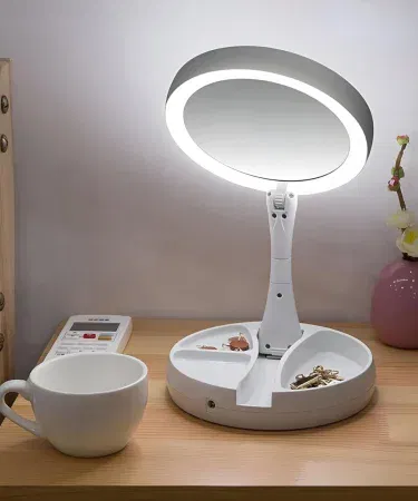 Portable makeup mirror with 10X magnification and LED light – compact travel beauty accessory, imagecaption=Compact LED‑lit 10X magnifying makeup mirror – perfect for on‑the‑go makeup and grooming.