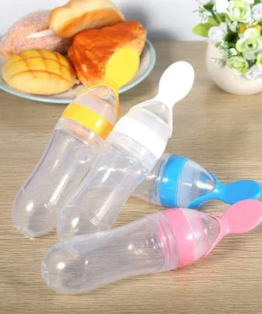 Soft silicone baby feeding spoon with easy‑grip handle, BPA‑free, suitable for infants and toddlers – vibrant colors, portable design.