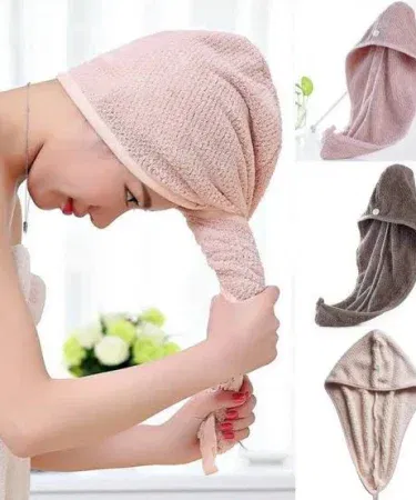 Magic Suction Cap Towel Holder mounted on a bathroom wall with towels neatly hanging, showcasing strong suction and sleek design
