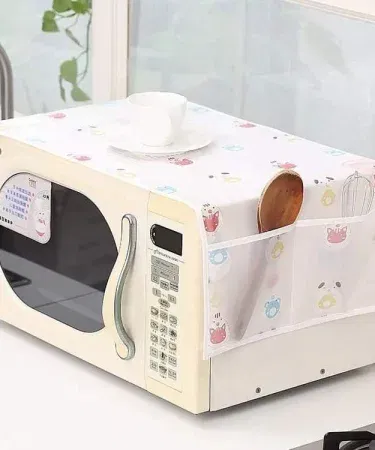 Microwave dust cover with double side pockets, waterproof and oilproof, placed on kitchen counter , imagecaption=Microwave Dust Cover – Double Side Pockets, Waterproof & Oilproof – Available at Khareedo/Kharedo ,