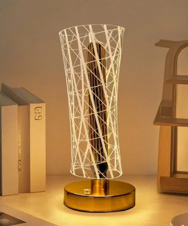 Modern LED Table Lamp with golden base and warm light on bedside table , imagecaption=Luxury decorative LED table lamp – perfect for bedroom, living room & office ,