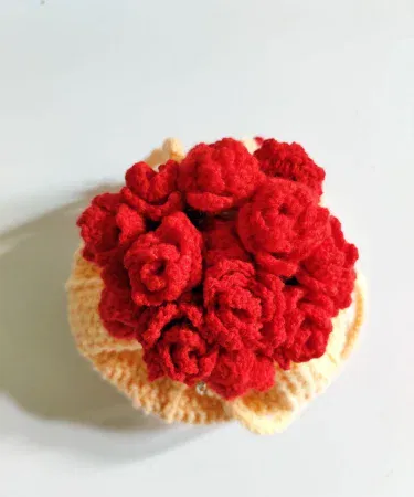 Handmade peach crochet bouquet potli bag with red floral accents
