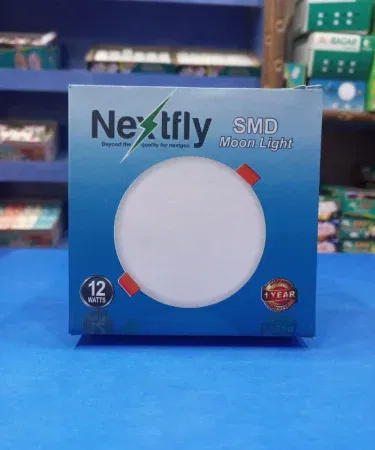 Nextfly 12W SMD Moon Light LED lamp glowing softly in a dark room, imagecaption=Nextfly 12W SMD Moon Light – perfect ambient lighting for any space.