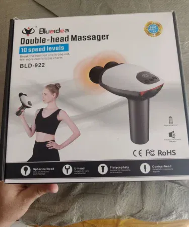 Dual Head Gun Massager with 8 interchangeable heads on white background, imagecaption=ARG Dual Head Gun Massager – 10 speed levels, USB rechargeable, noiseless operation,