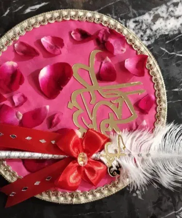 Elegant Nikkah signature pen with feather tip and decorative rose‑petal tray, imagecaption=Premium Nikkah signature pen set – perfect for wedding signing and photoshoots,