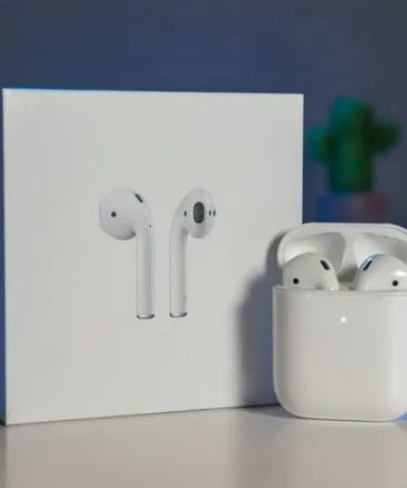 Apple AirPods Generation 2 Jieli wireless earbuds with charging case, displayed on a sleek black background.