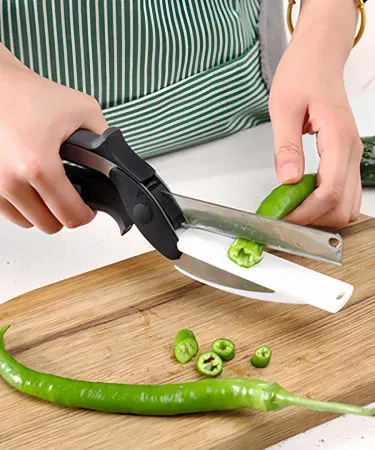Quick Vegetable Chopper – Clever Cutter 2in1 Knife Scissor showing stainless steel blade and ergonomic handle, imagecaption=Multi‑purpose 2in1 kitchen scissors knife for fast fruit and vegetable cutting.