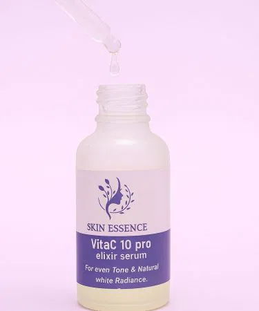 Vitimin C 10% whitening serum bottle with glowing skin background, imagecaption=Professional‑grade Vitimin C 10% Whitening Serum – radiant skin in a drop ,