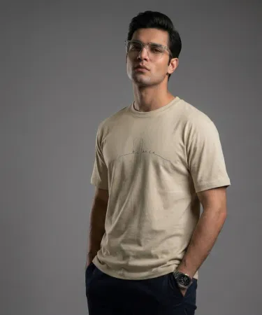 Men's Beige Pure Cotton T-Shirt with Compass Graphic - Premium Export Quality Cotton Tee - Khareedo Pakistan , imagecaption=Stylish Men's Beige Compass Graphic Cotton T-Shirt featuring soft export-quality fabric and regular fit, available with Check on Delivery across Pakistan exclusively at Khareedo & Kharedo.
