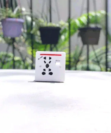 Universal 9-in-1 power plug adapter with multiple fittings sold in Pakistan